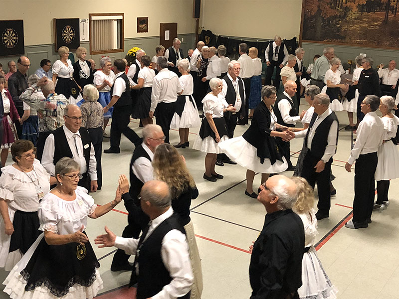 Picture of SWOSDA Square Dance with dancers wearing black and white outfits